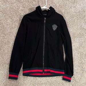 Gucci hysteria knight sweatshirt, along with a Gucci bag.